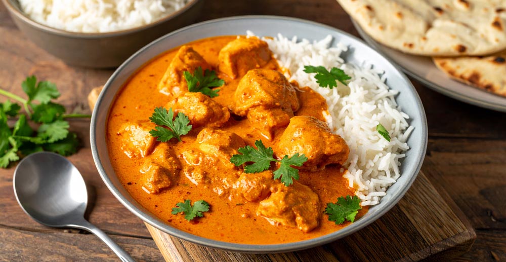 Romige Tikka Masala geserveerd met rijst